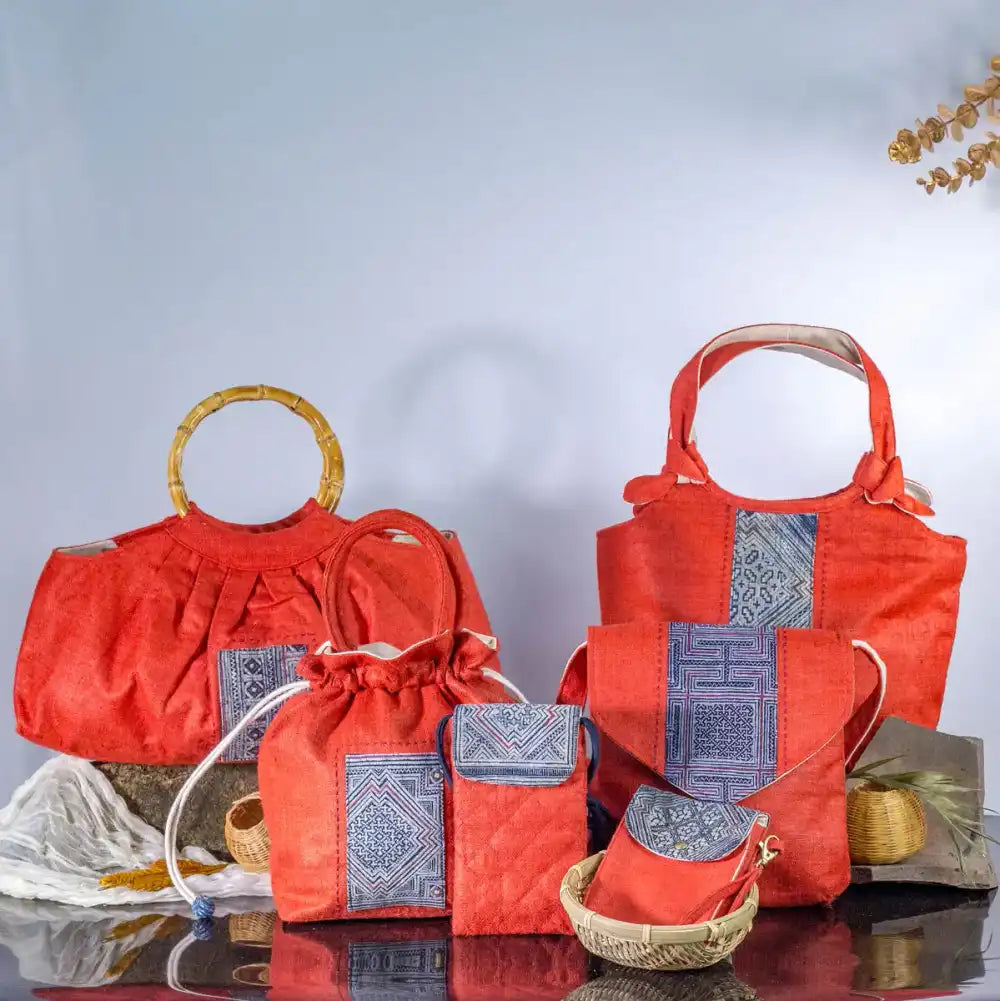 Set of red hemp bucket bags with H’mong patches, handcrafted eco-friendly handbags.