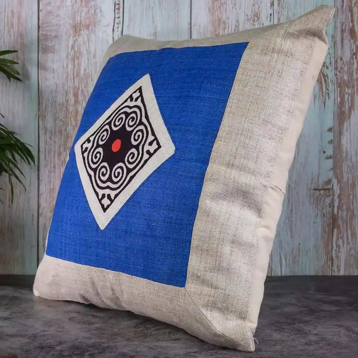 Vindigo cushion cover blue embroidered spiral dot side angled view