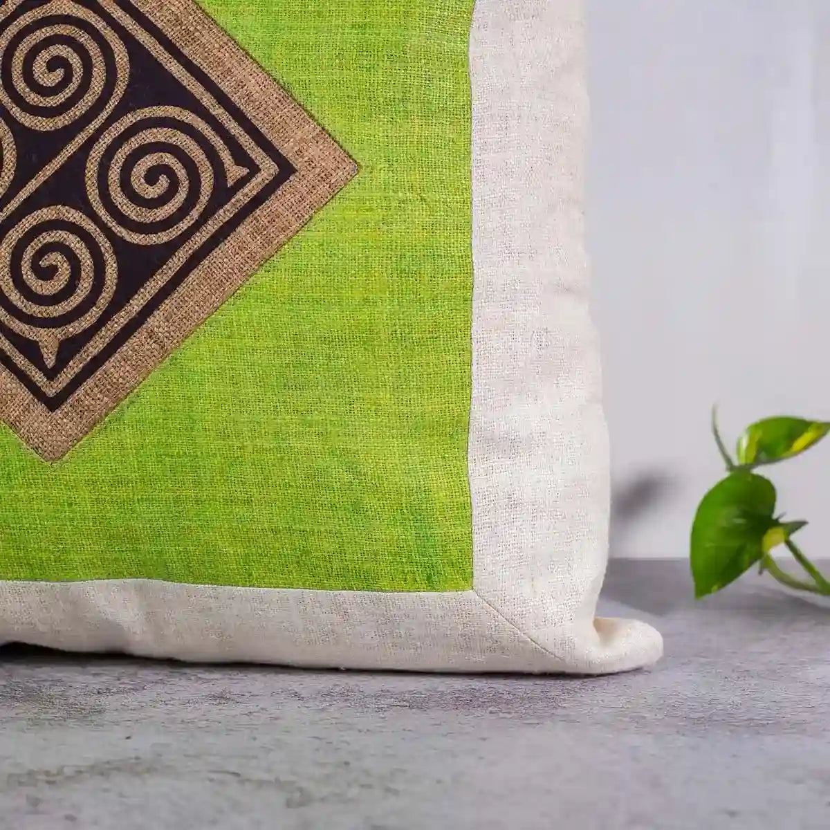 Vindigo cushion cover green embroidered spiral side angled view