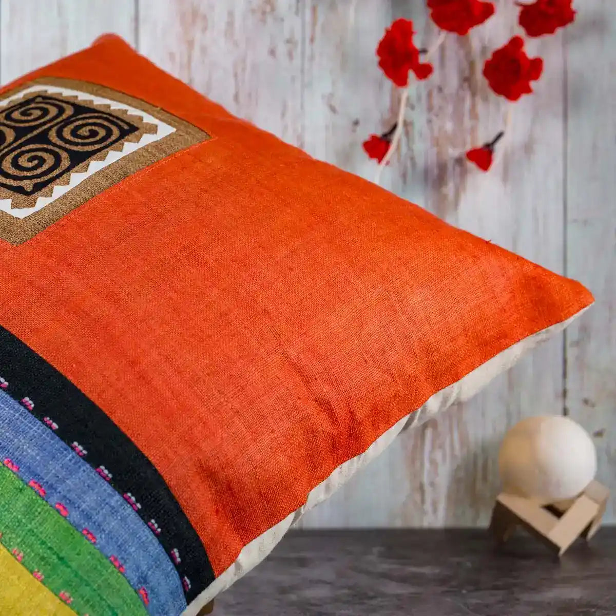 Vindigo cushion cover orange embroidered spiral side close view