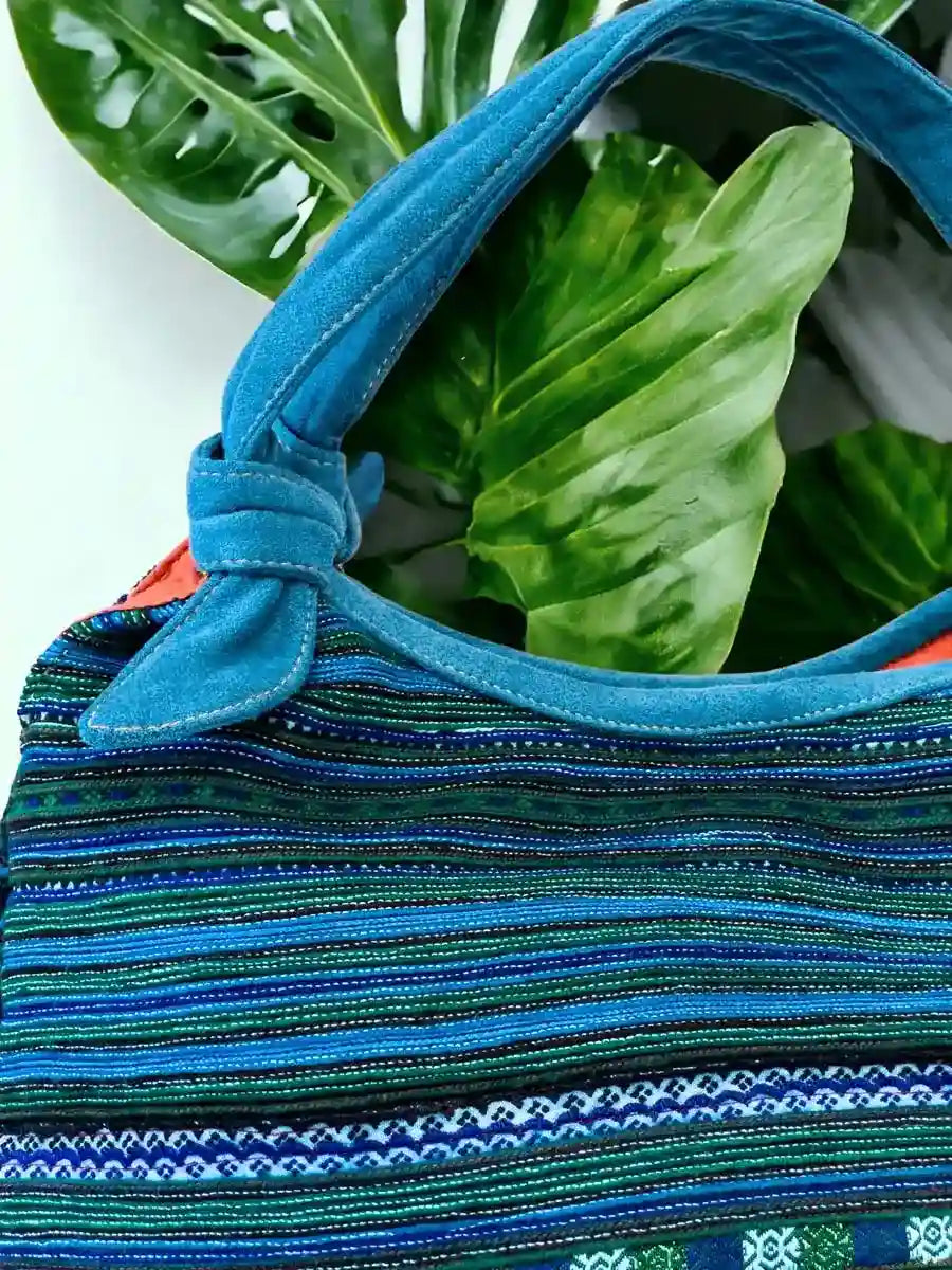 Vindigo handbag blue embroidered with orange lining side view