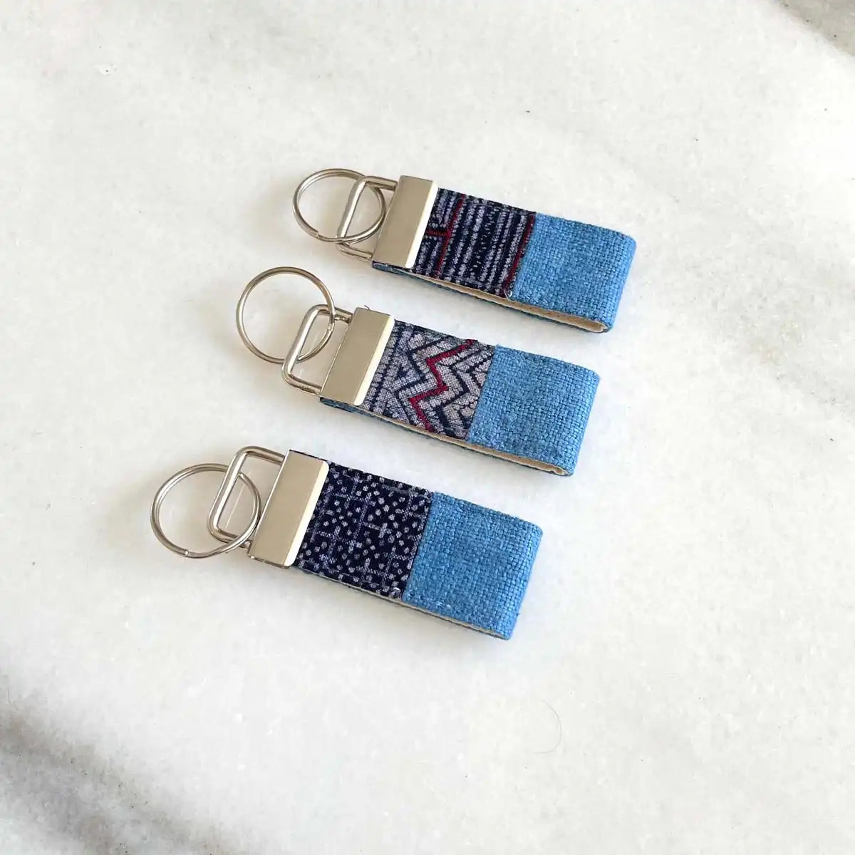 Vindigo keychain blue embroidered front view set of three
