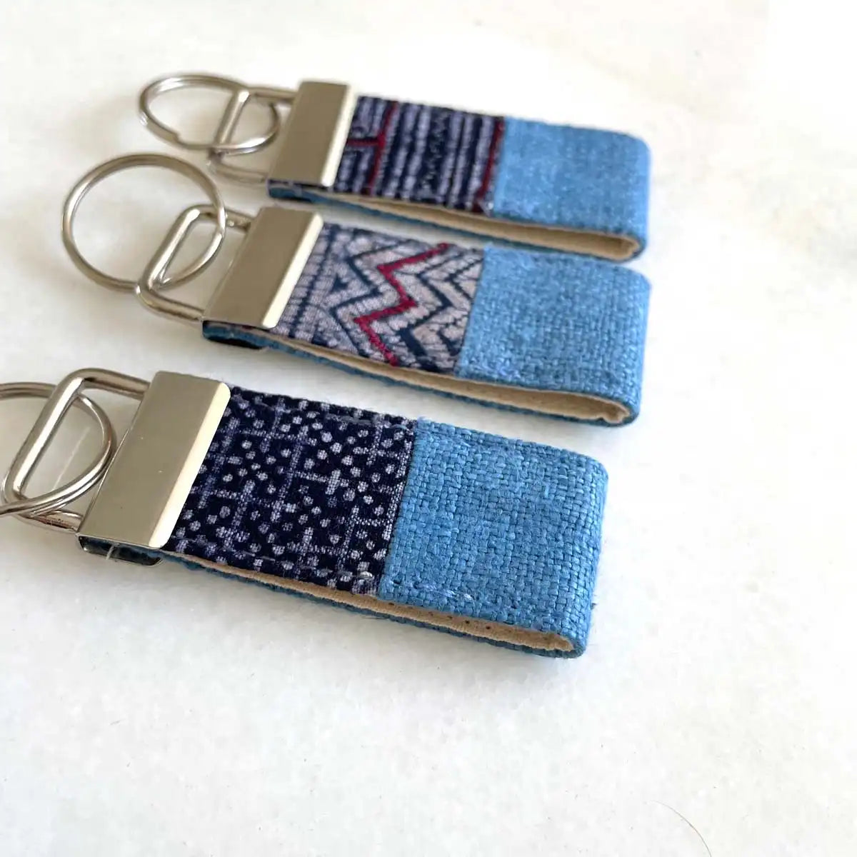 Vindigo keychain blue embroidered front angled close view