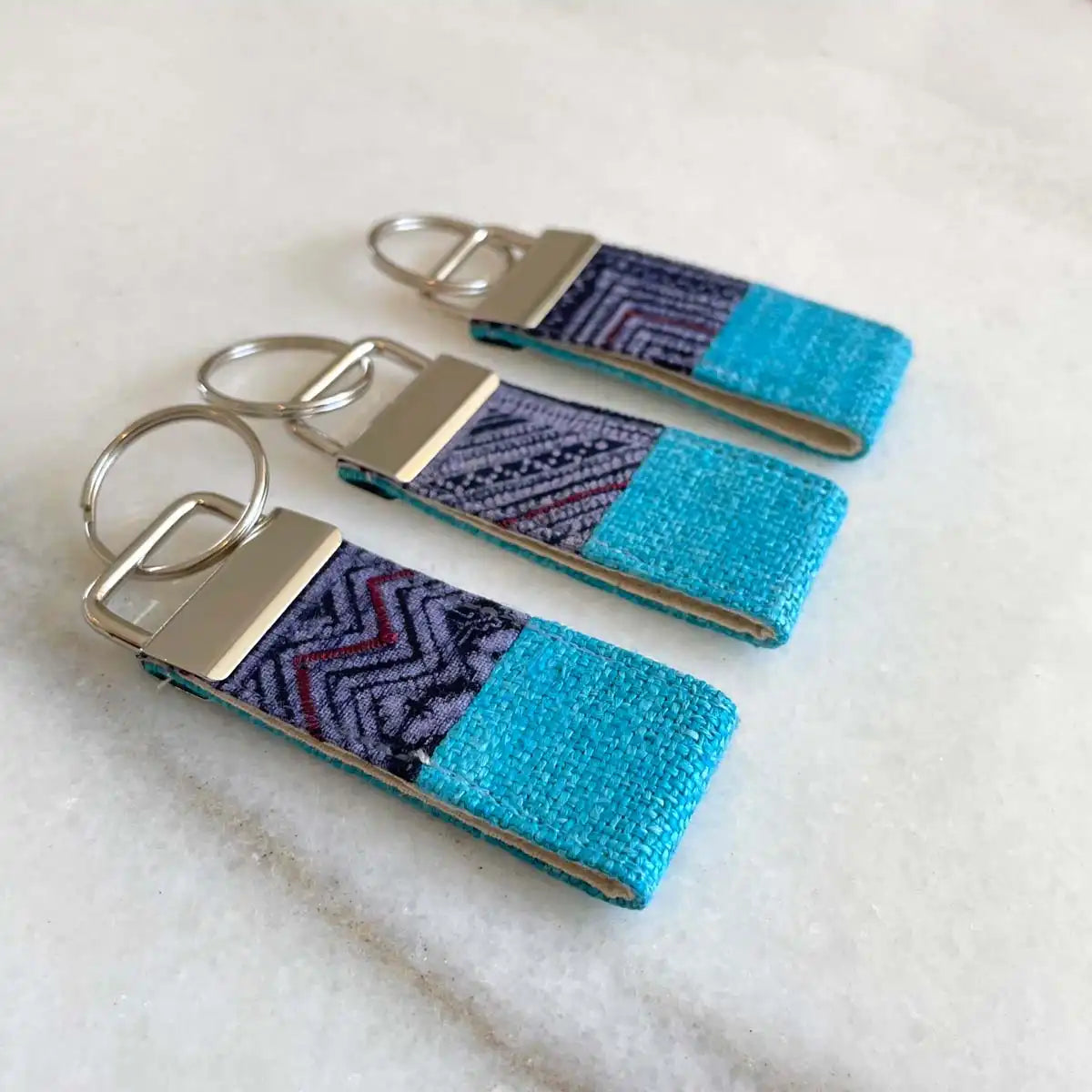 Vindigo keychain blue embroidered front group display