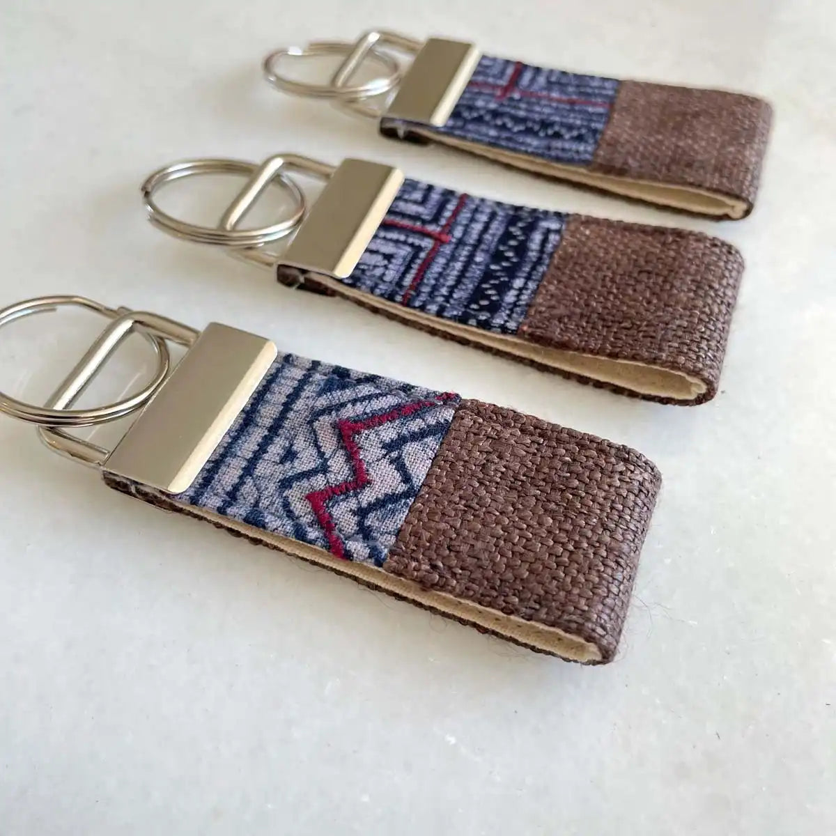 Vindigo keychain brown embroidered group angled view