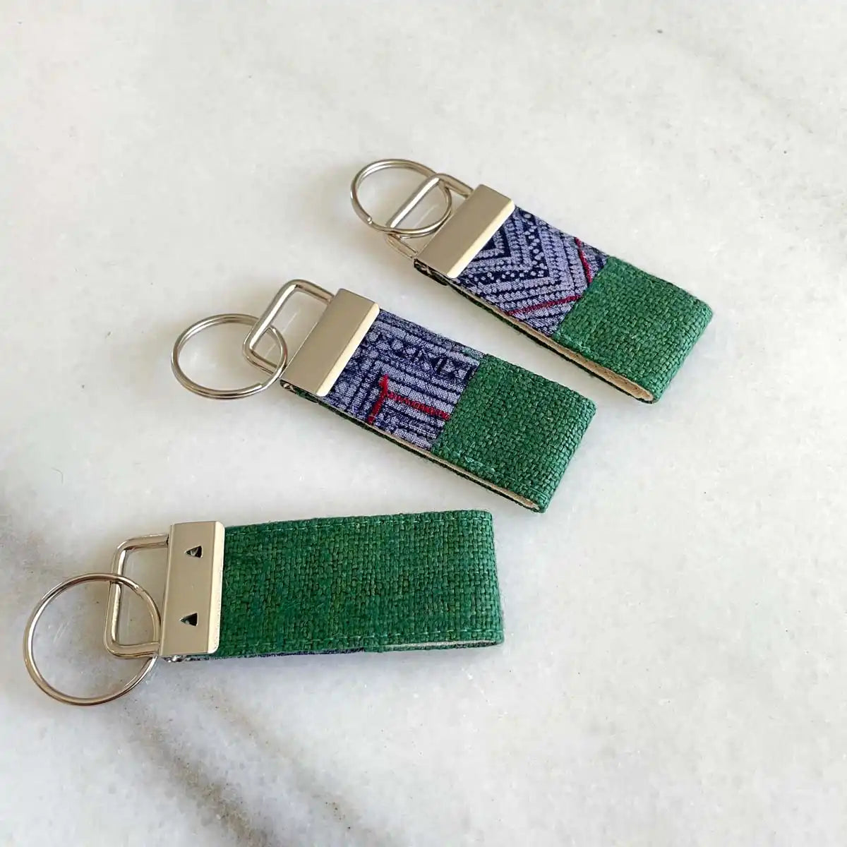 Vindigo keychain dark green embroidered angled group view