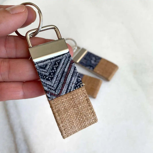 Vindigo keychain light brown embroidered close detail in hand