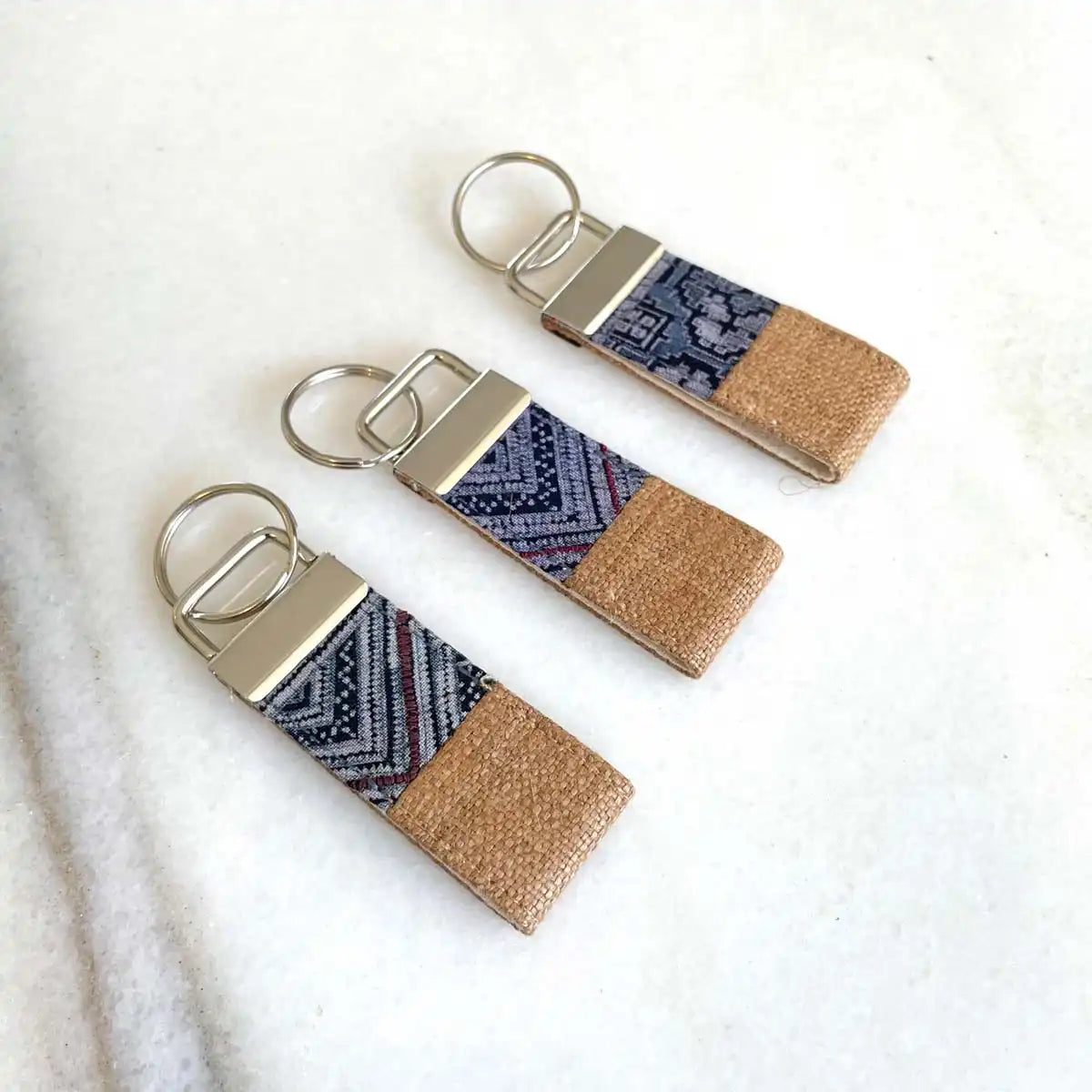 Vindigo keychain light brown embroidered front view set of three