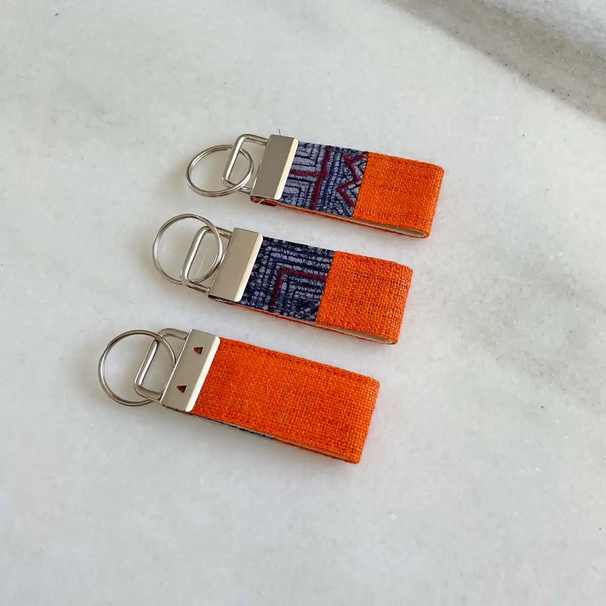 Vindigo keychain orange embroidered group angled view