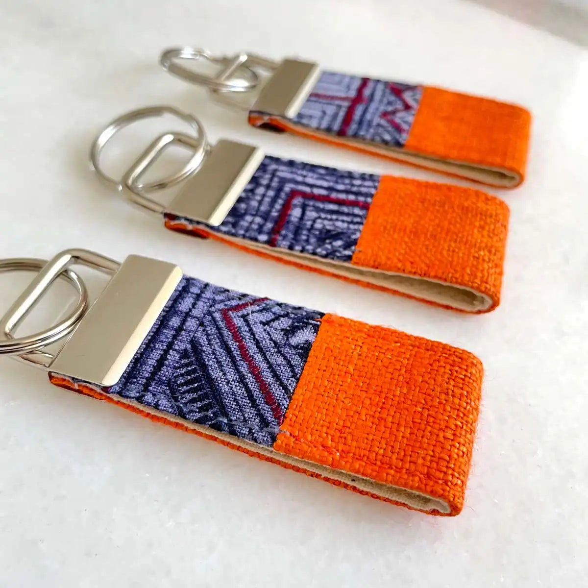 Vindigo keychain orange embroidered group front close view