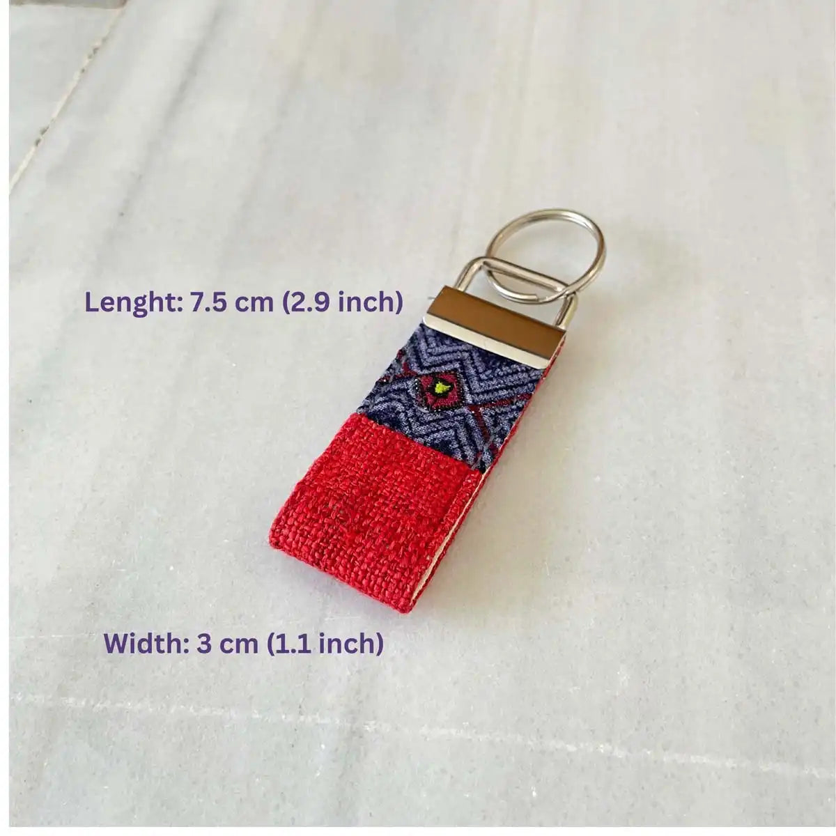 Vindigo keychain orange embroidered lifestyle view with size measurement