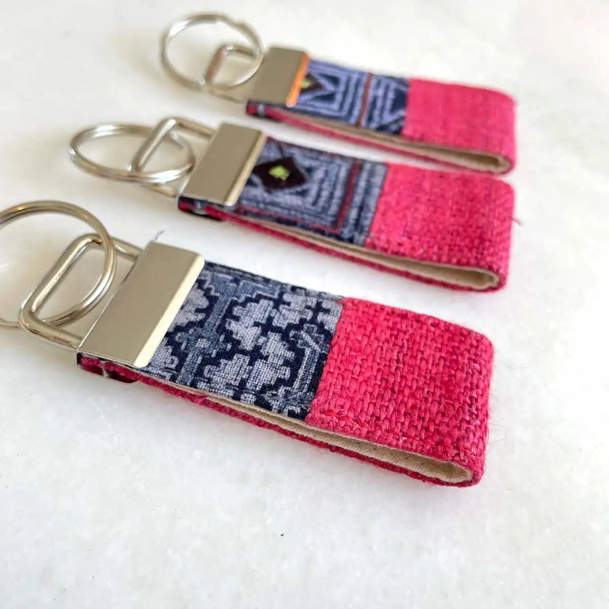 Vindigo keychain pink embroidered angled group close view