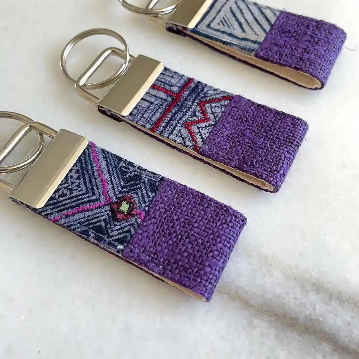 Vindigo keychain purple embroidered group front close view