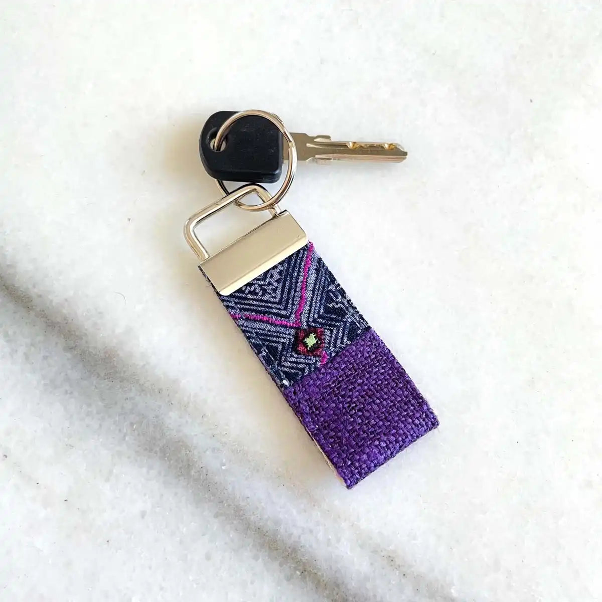 Vindigo keychain purple embroidered lifestyle view with key