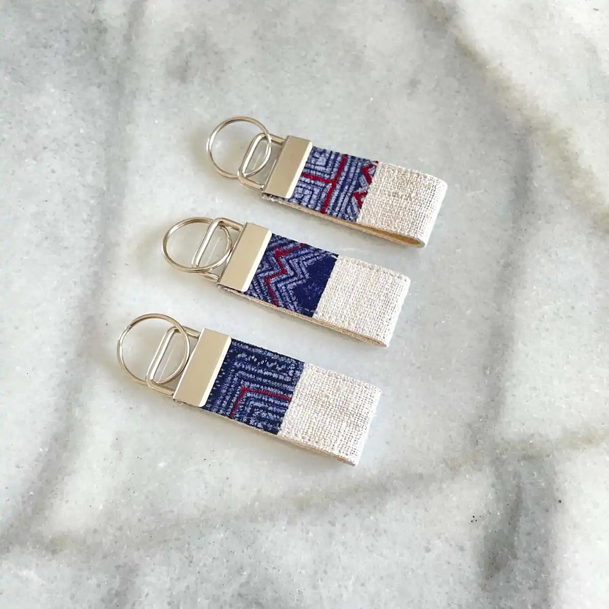 Vindigo keychain white embroidered front view set of three