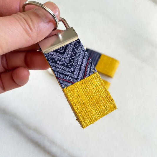 Vindigo keychain yellow embroidered bright close detail in hand