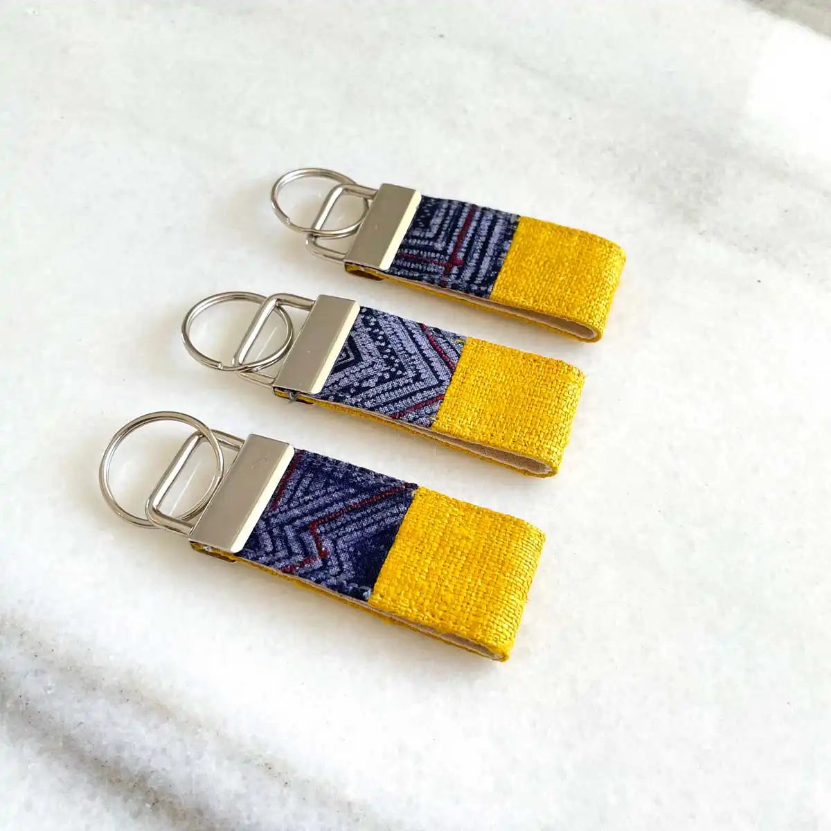 Vindigo keychain yellow embroidered bright front view set of three