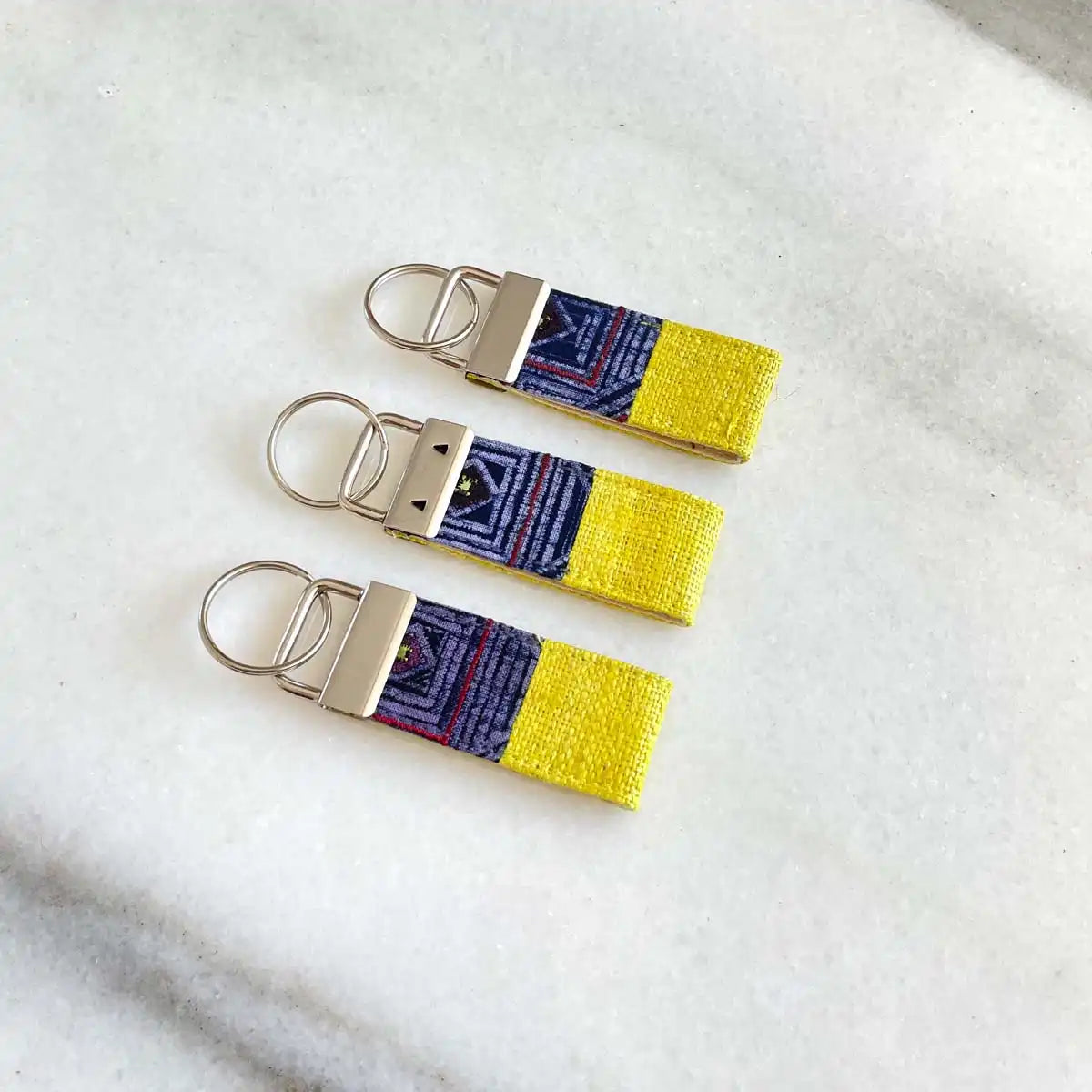 Vindigo keychain yellow embroidered front view set of three