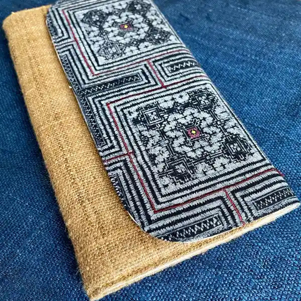 Vindigo long purse beige black embroidered angled side view