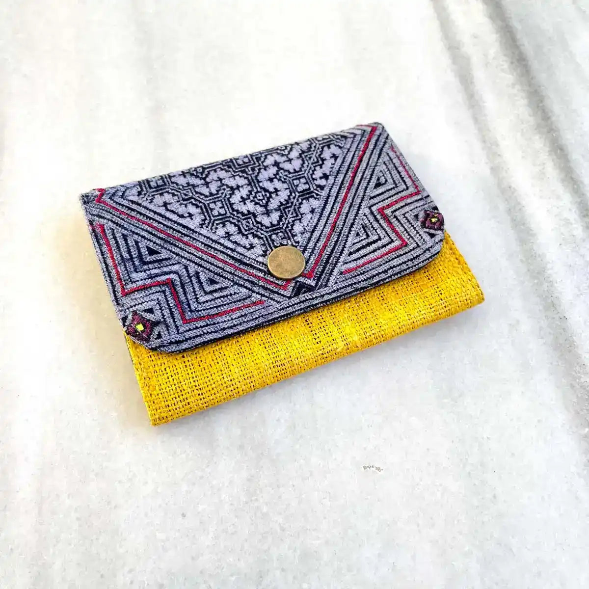 Vindigo wallet yellow embroidered front close view