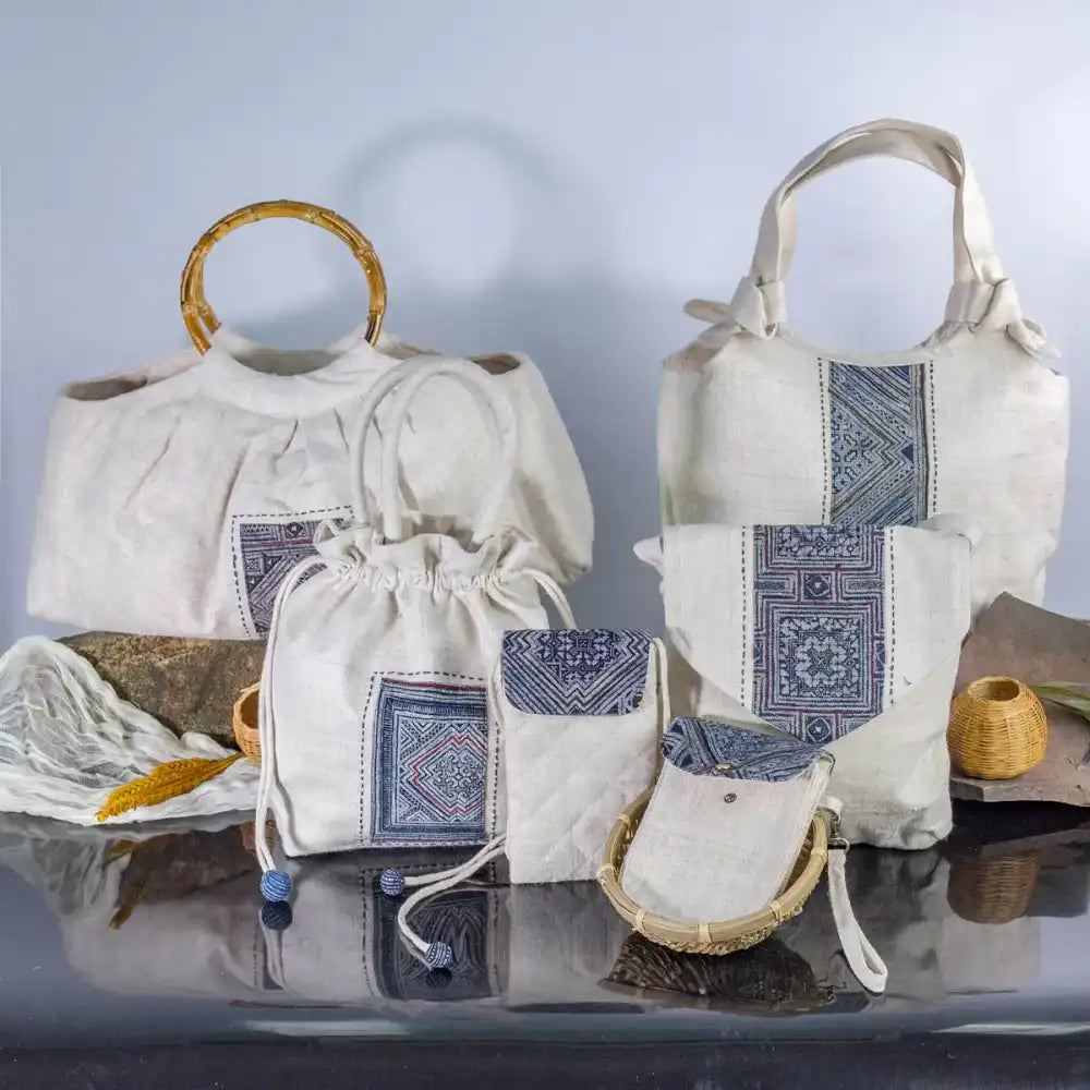 Collection of white hemp bucket bags with H’Mong batik patches