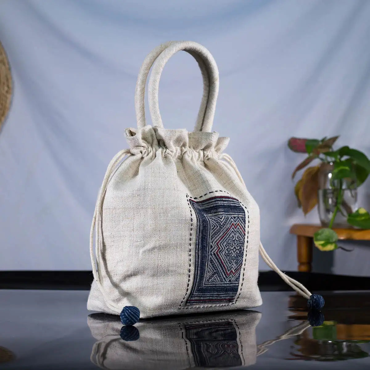 White hemp bucket bag with H’Mong batik patch – side view