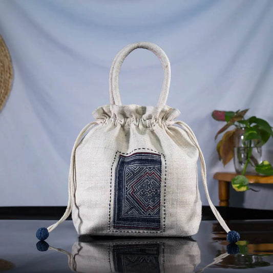 White hemp bucket bag with H’Mong batik patch – standing display