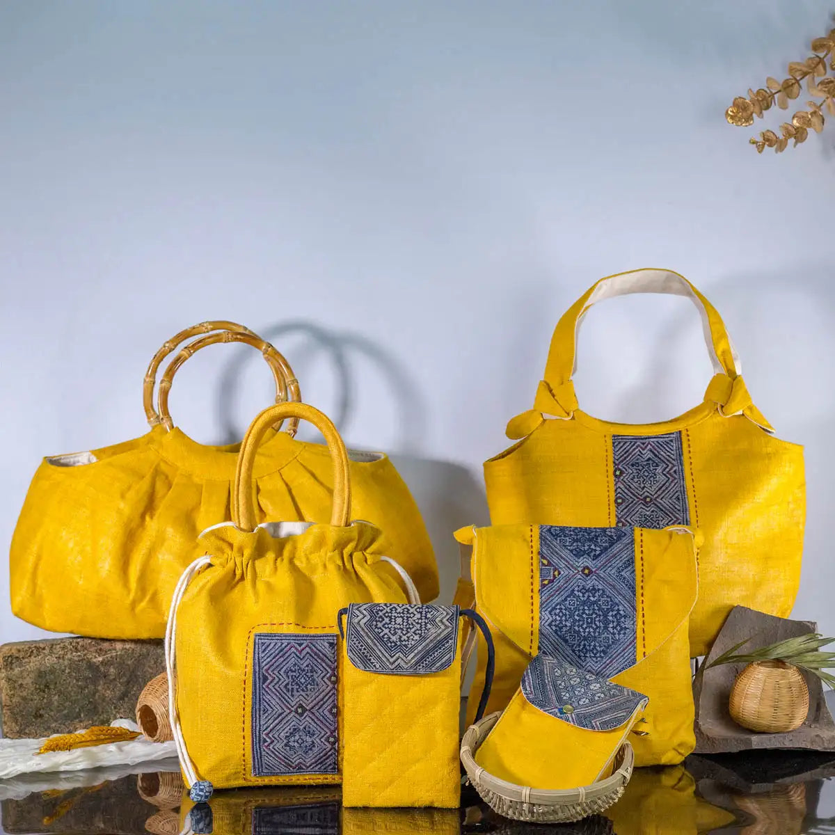 Collection of yellow hemp drawstring bags and accessories handmade by Vindigo