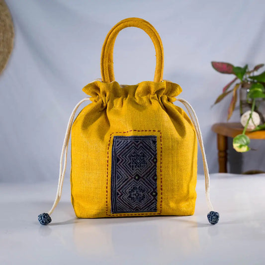 Front view of yellow hemp string bucket bag - handmade by Vindigo
