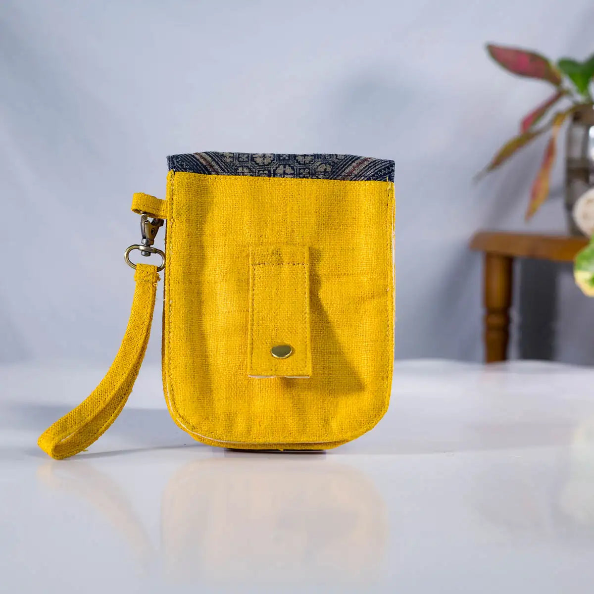 Back view of yellow hemp flip phone belt bag with H’Mong patch, eco-friendly handmade design.