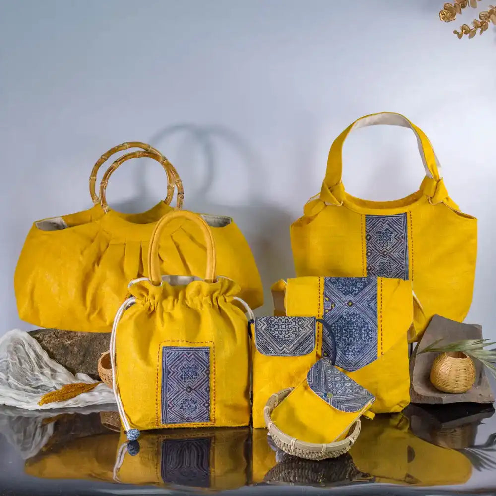 Handmade yellow hemp handbag with H’Mong patch standing upright – Vindigo eco bag