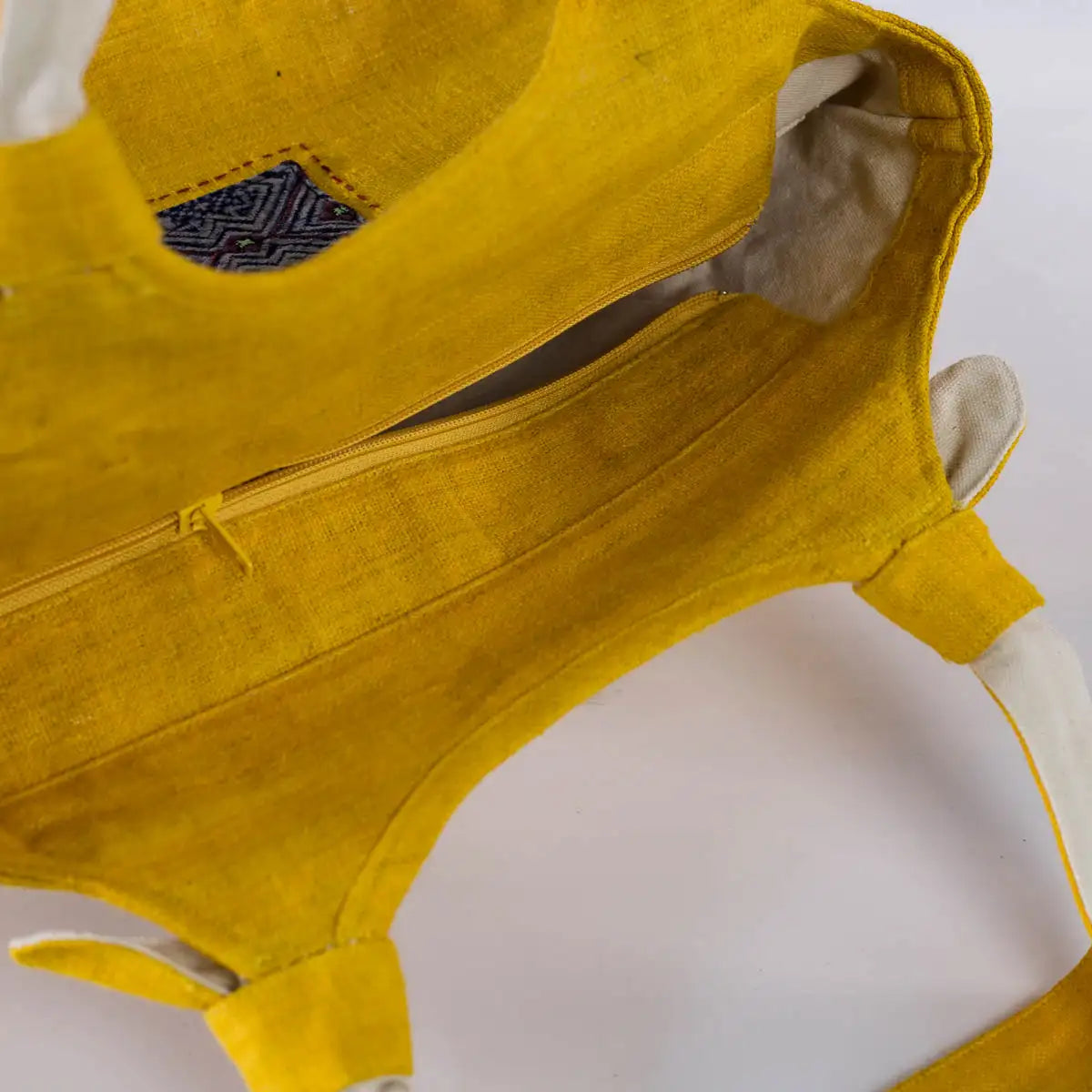 Interior view of yellow hemp handbag showing zippered pocket – Vindigo handmade bag