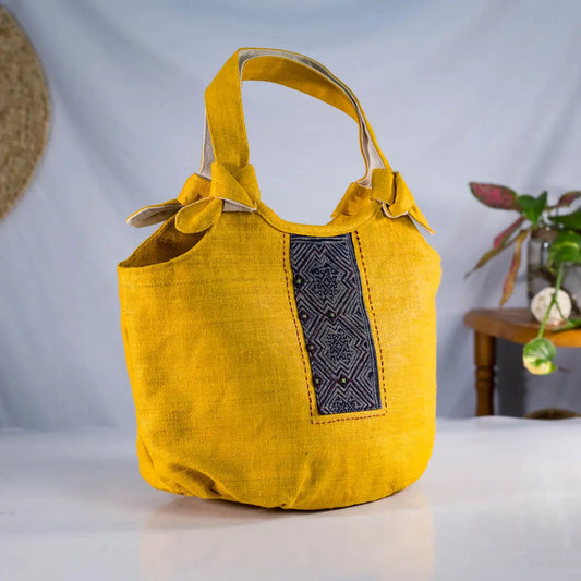 Side angle of handmade hemp handbag with sturdy handles – Vindigo sustainable handbag