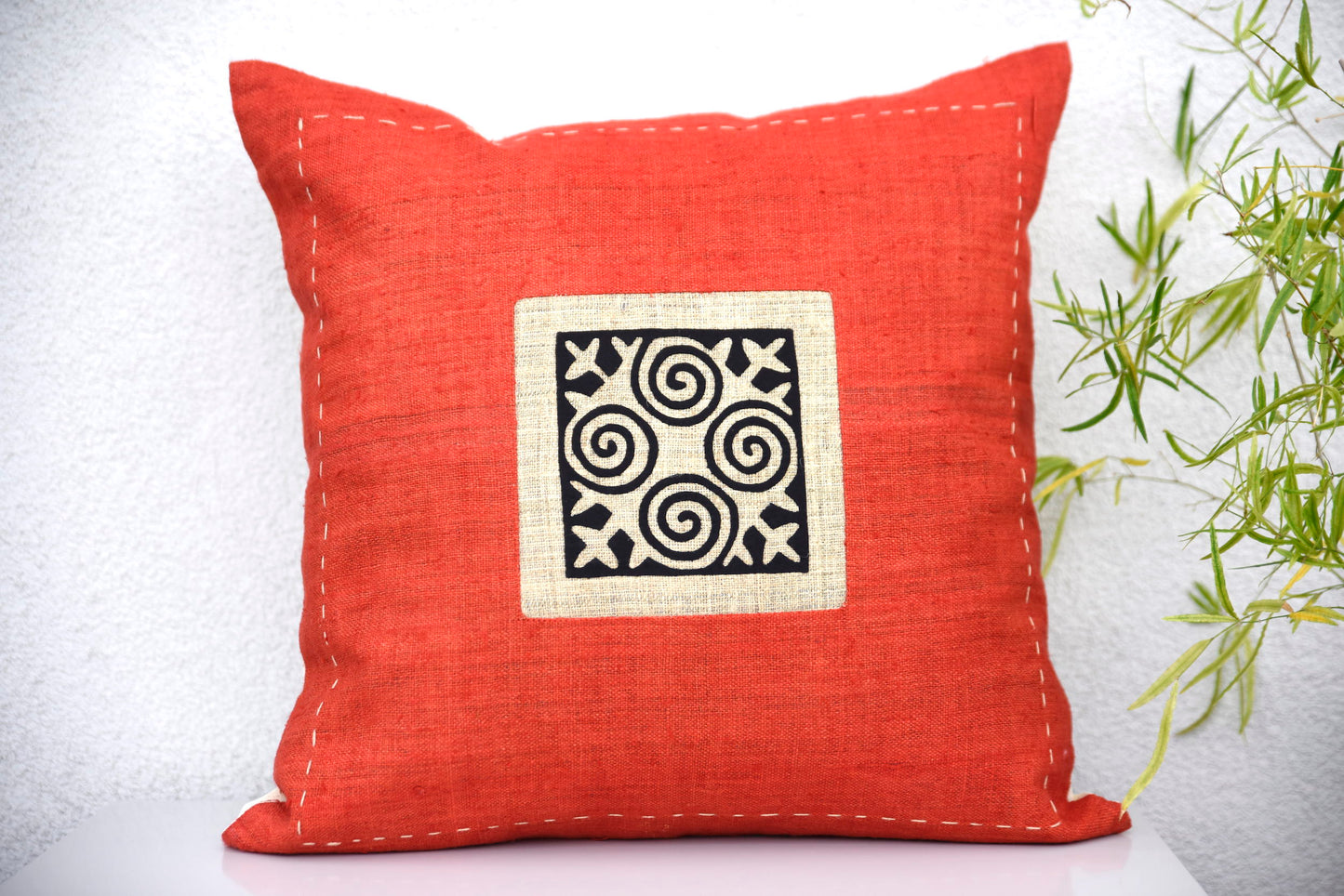 Red Hemp Cushion Cover with hand-stitches run along all sides