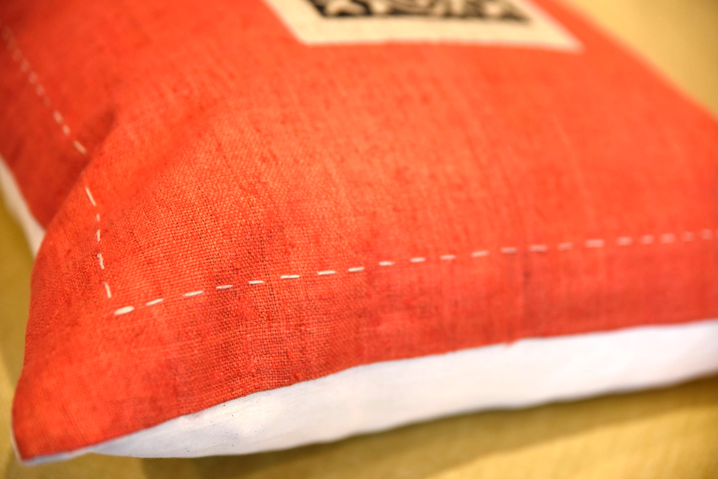 Red Hemp Cushion Cover with hand-stitches run along all sides