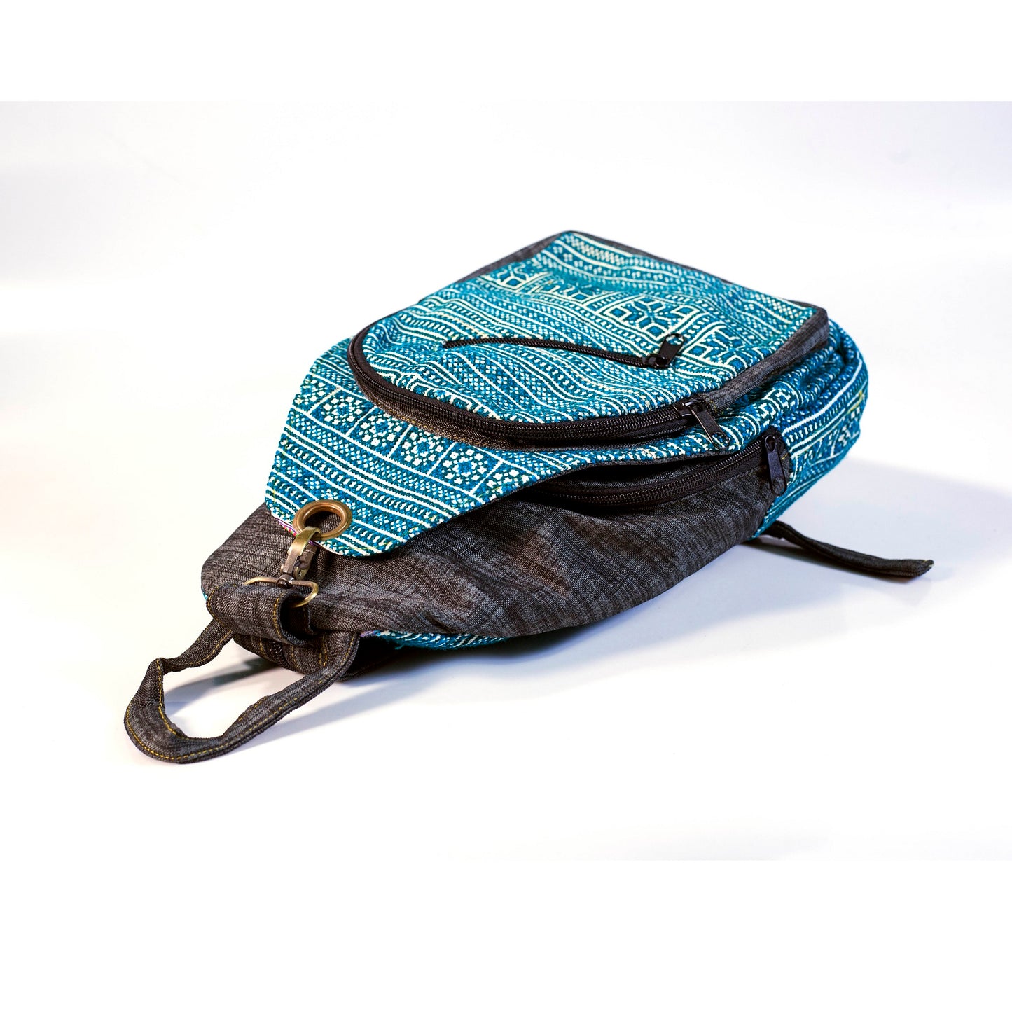 Multi-purpose backpack and sling, light blue hand-embroidery fabric, dark blue trim