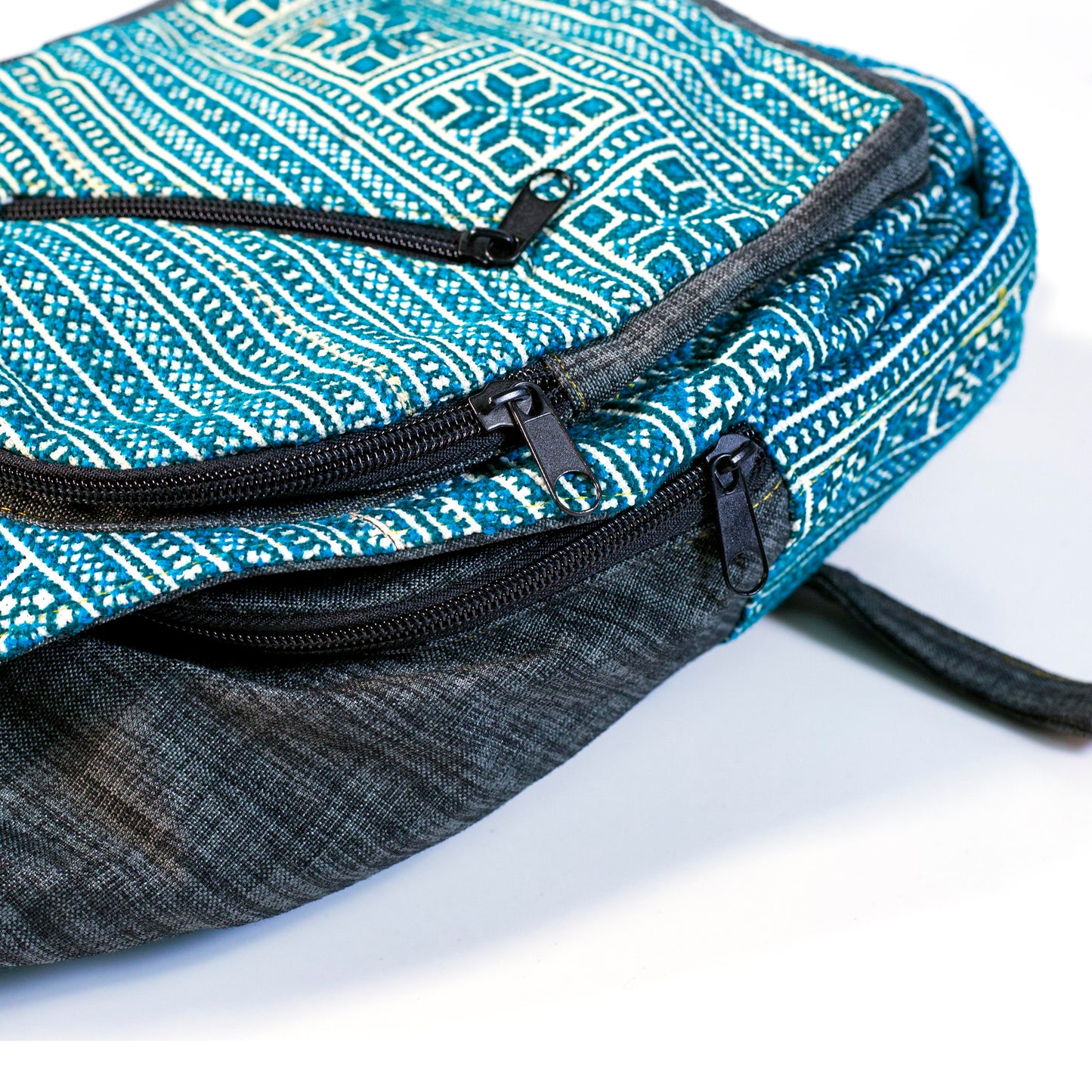 Multi-purpose backpack and sling, light blue hand-embroidery fabric, dark blue trim