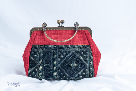 Red bag with vintage tribal embroidery and straight copper-binding