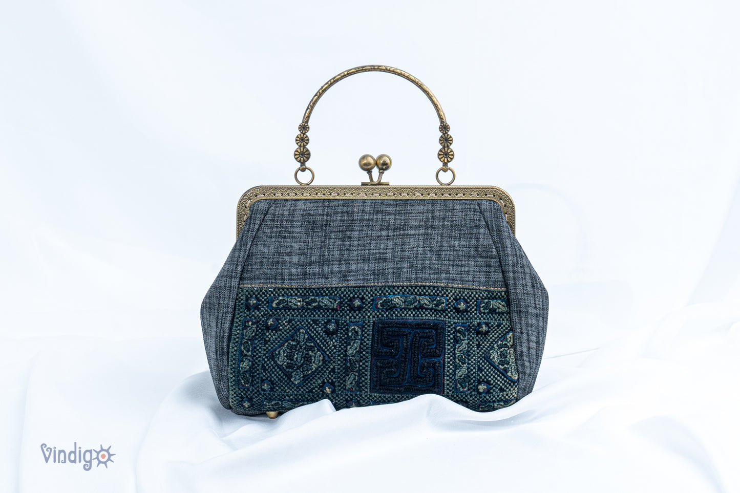 Grey bag with vintage tribal embroidery and straight copper-binding
