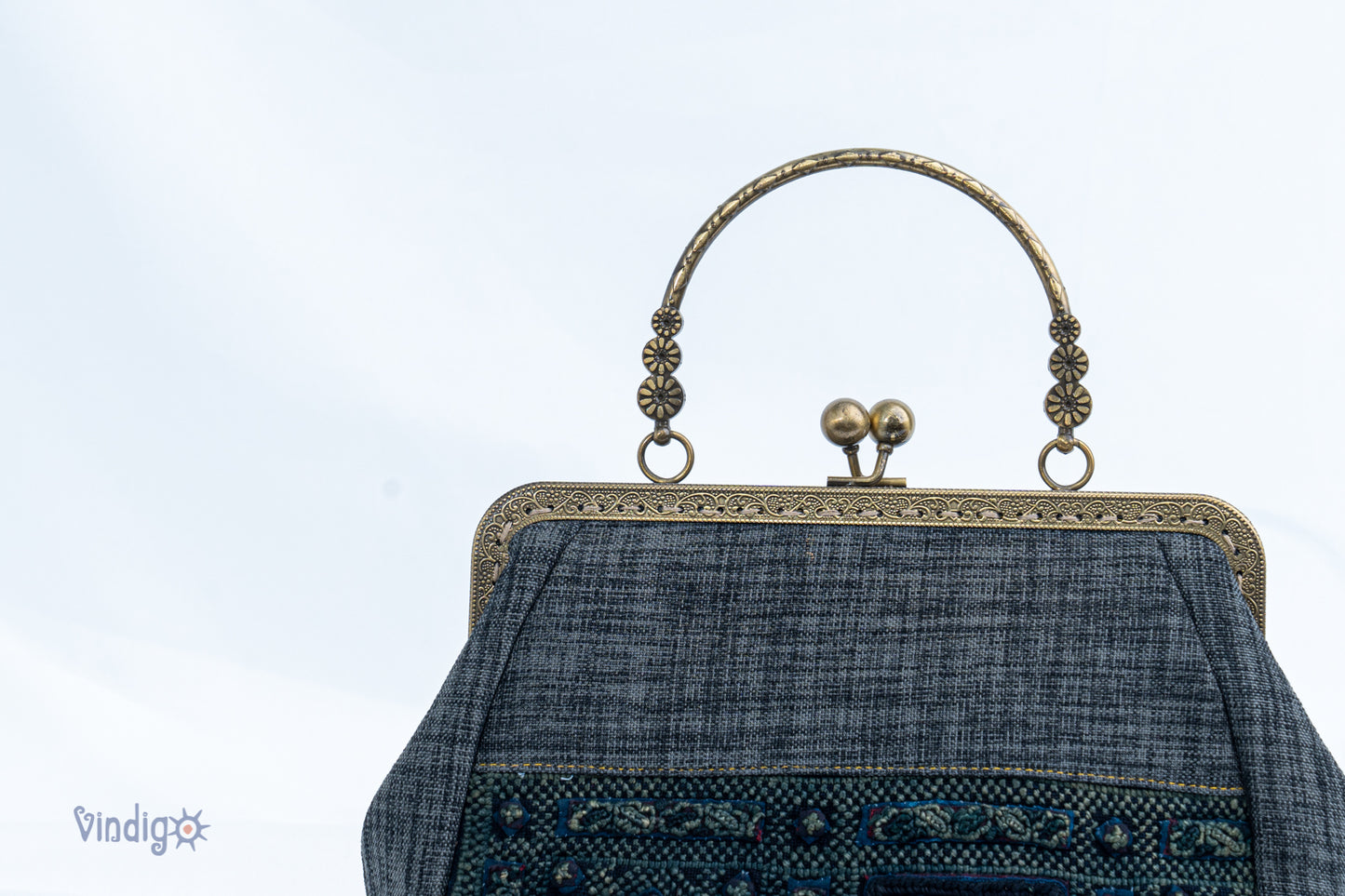 Grey bag with vintage tribal embroidery and straight copper-binding