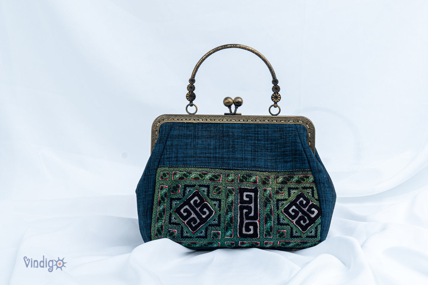 Blue bag with vintage tribal embroidery and straight copper-binding