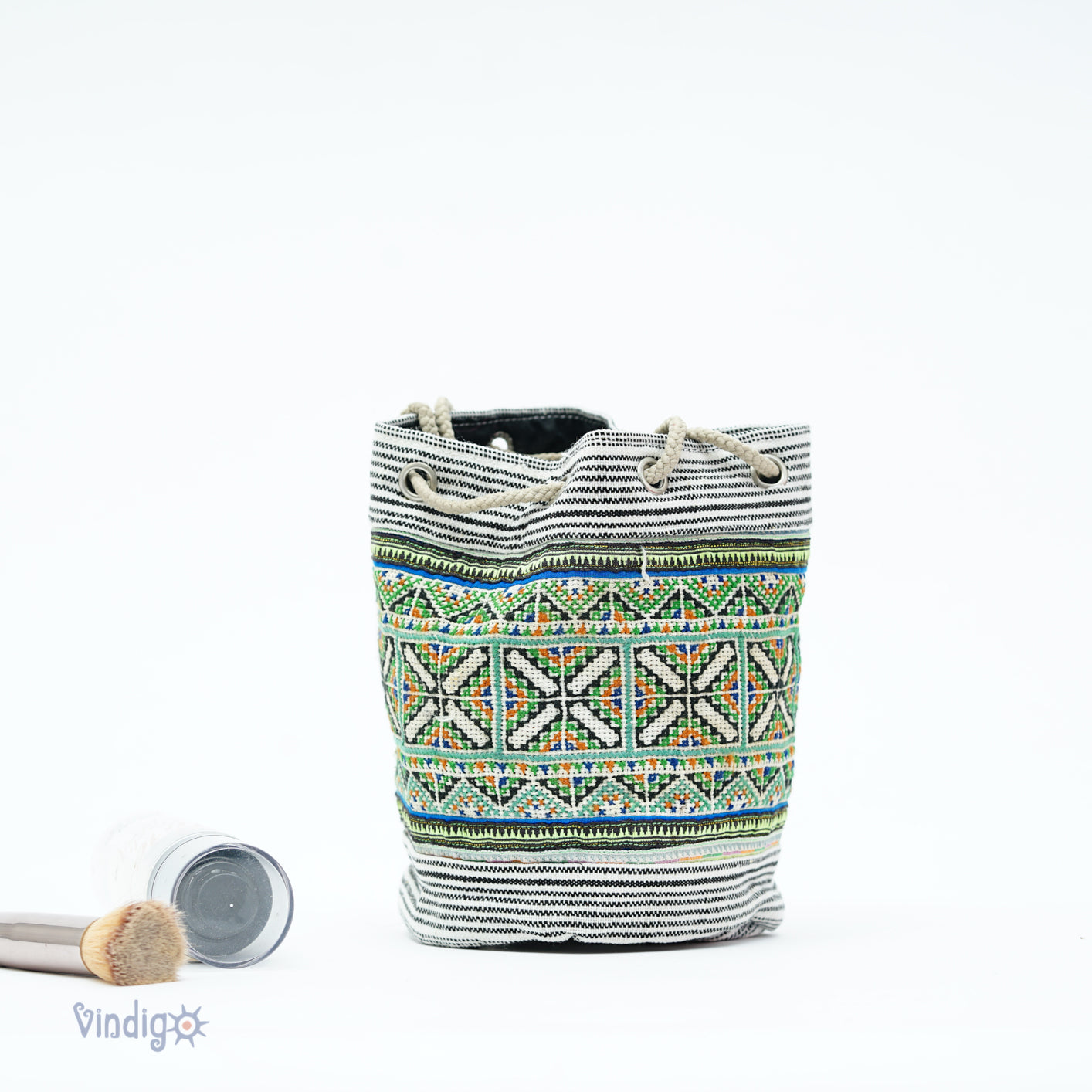Beige mini hemp bag with string, black and white stripe with green tribal pattern
