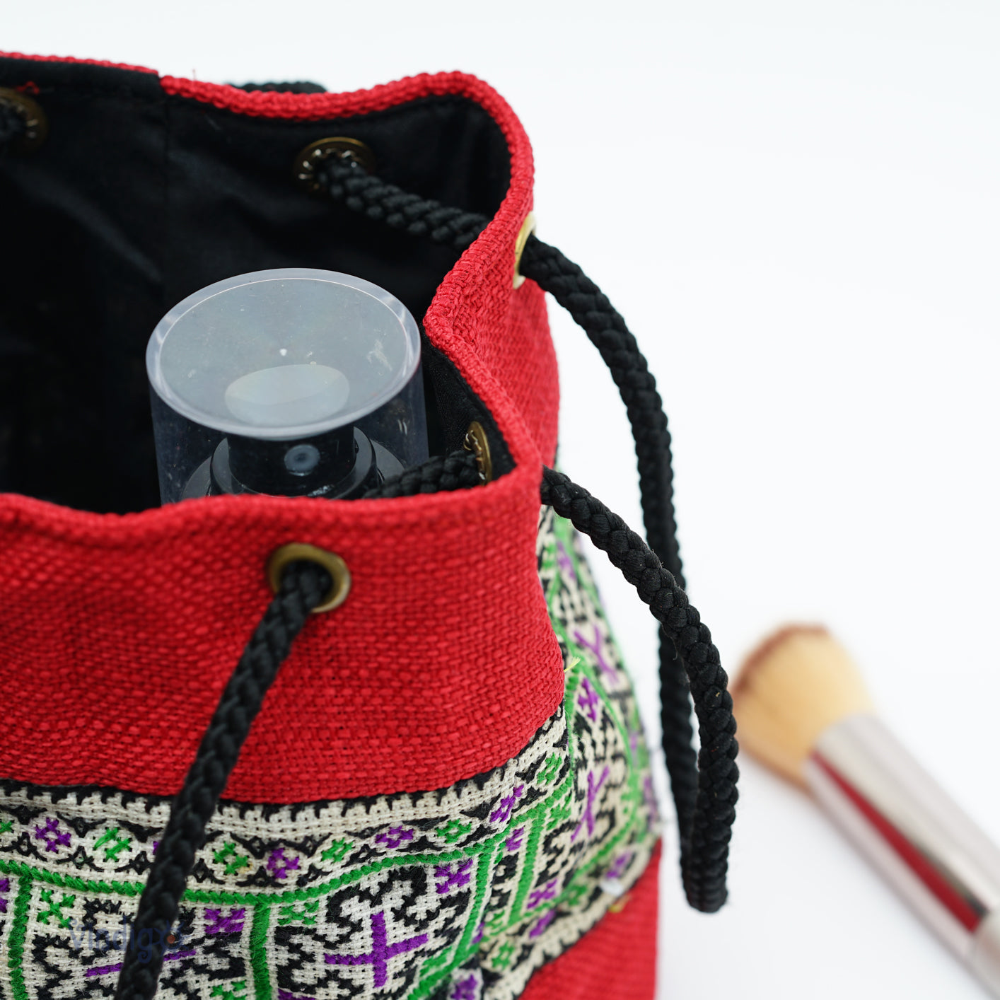Red mini bag with string, green tribal pattern