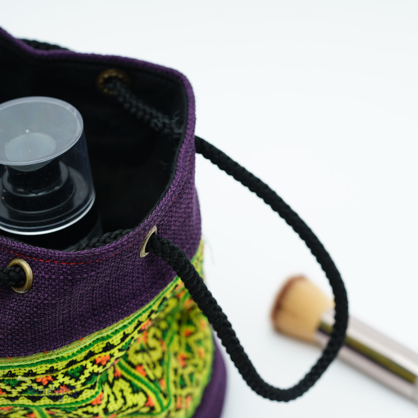 Purple mini hemp bag with string, green tribal pattern