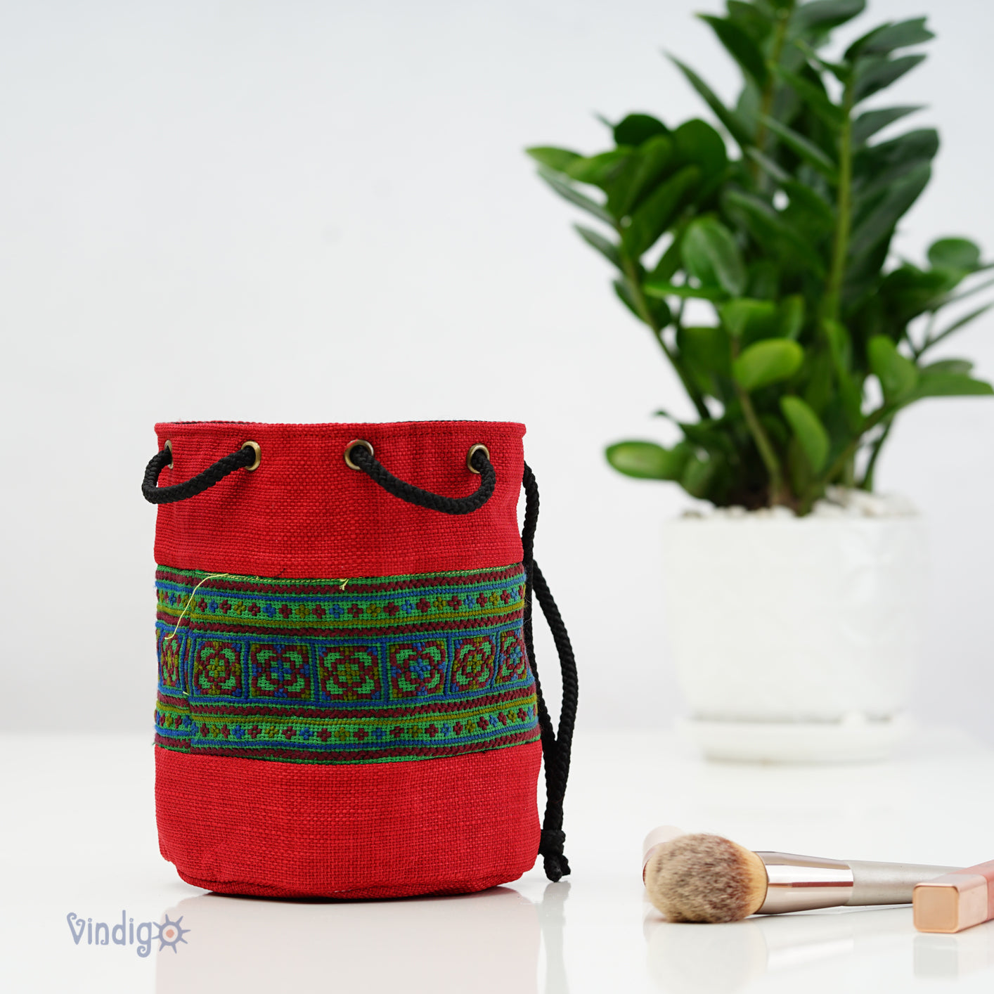 Red multi-purpose bag with string, Hemp, tribal pattern on green background